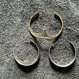Simple gold bracelet and open hoop silver earrings
